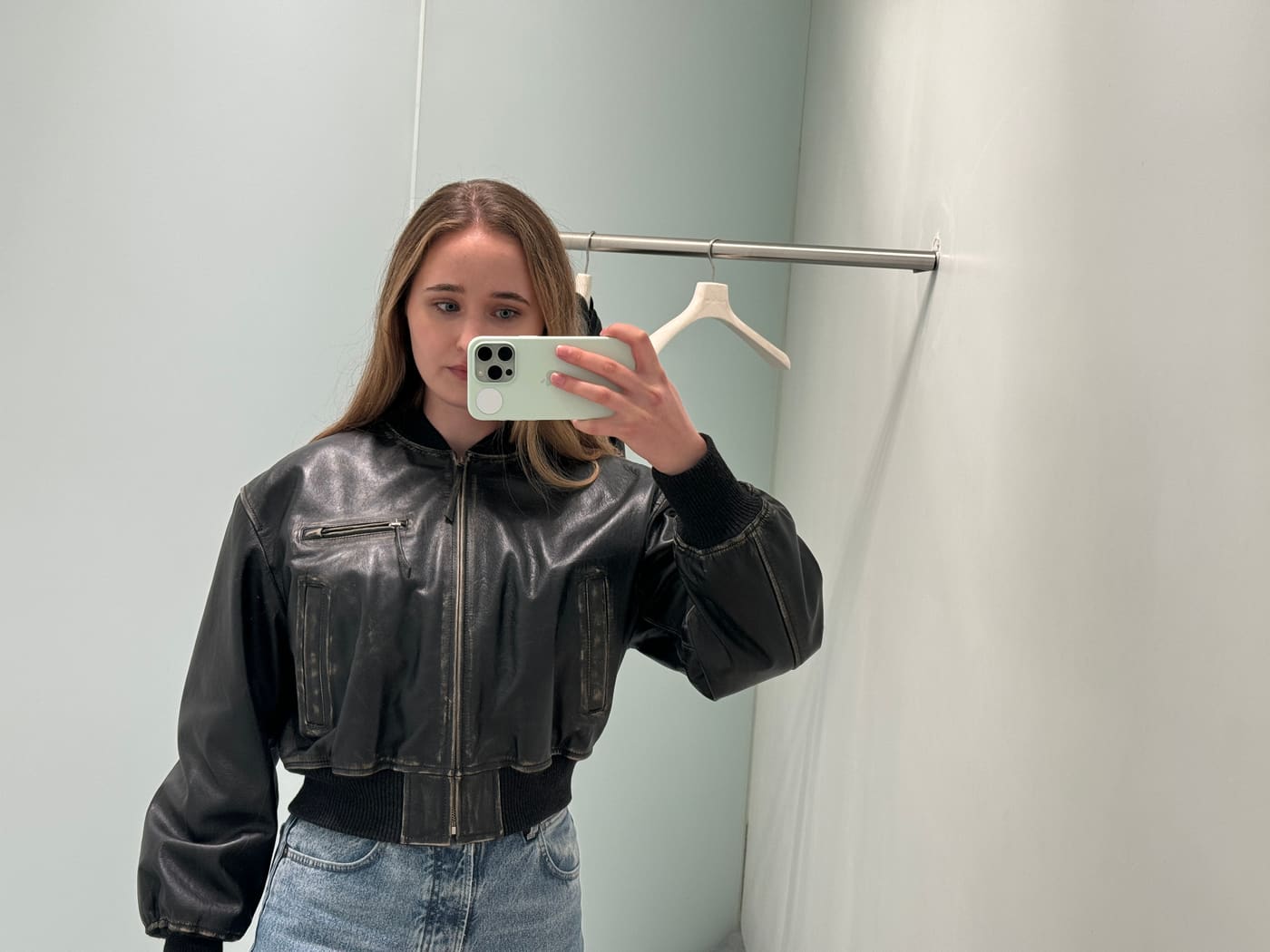 Mirror selfie portrait in a black leather jacket