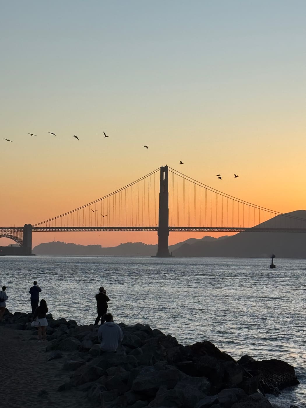 Cropped sunset view of the Golden Gate Bridge over the bay