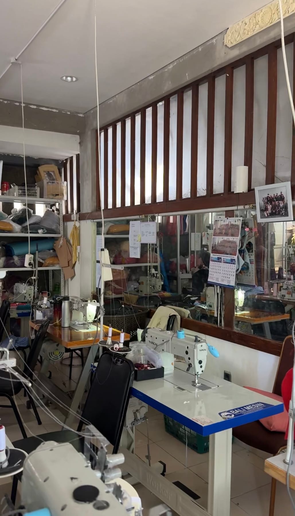 Sove behind-the-scenes photo of a garment production studio with sewing machines